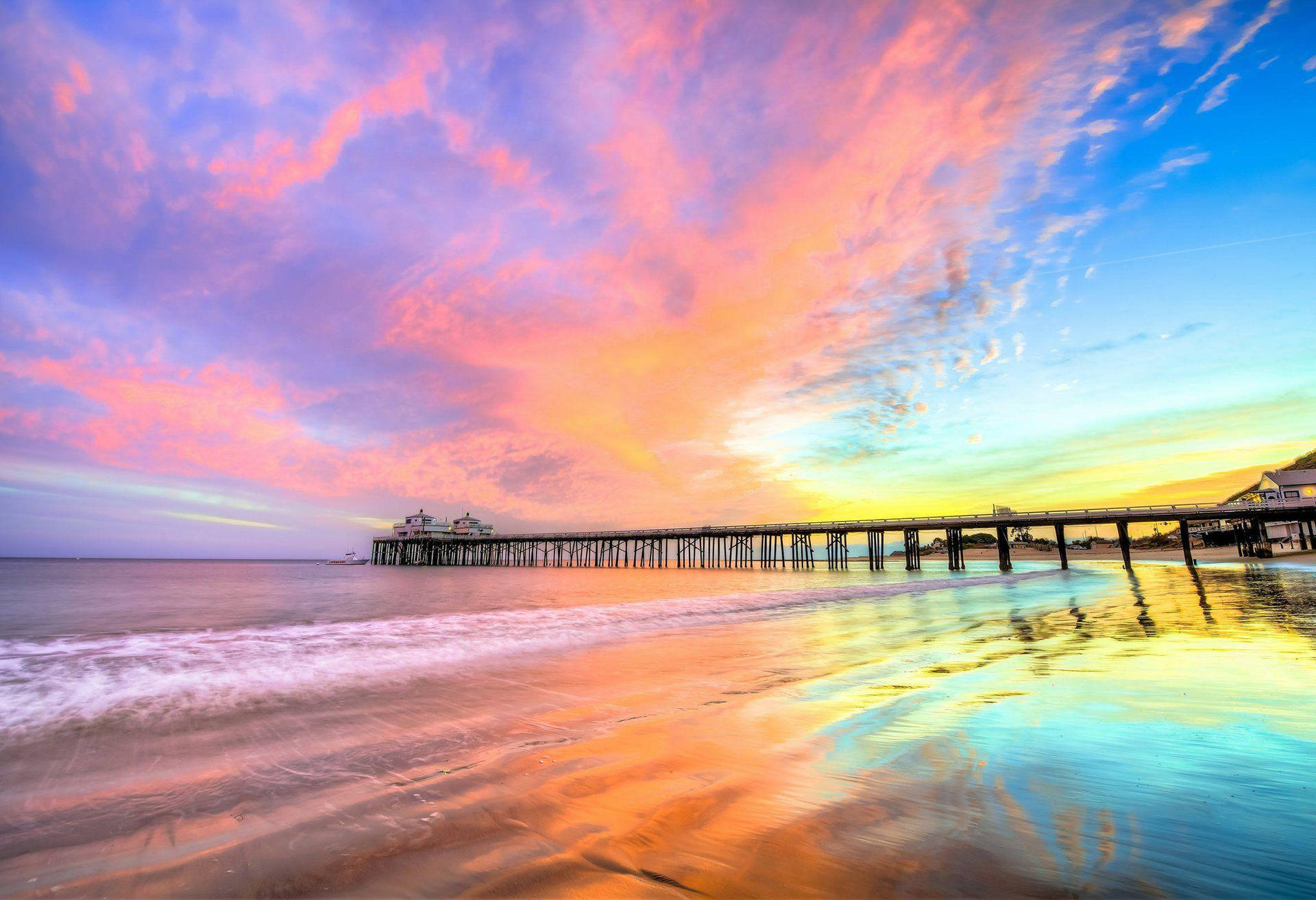 Rainbow Skies Over Malibu Beach Background