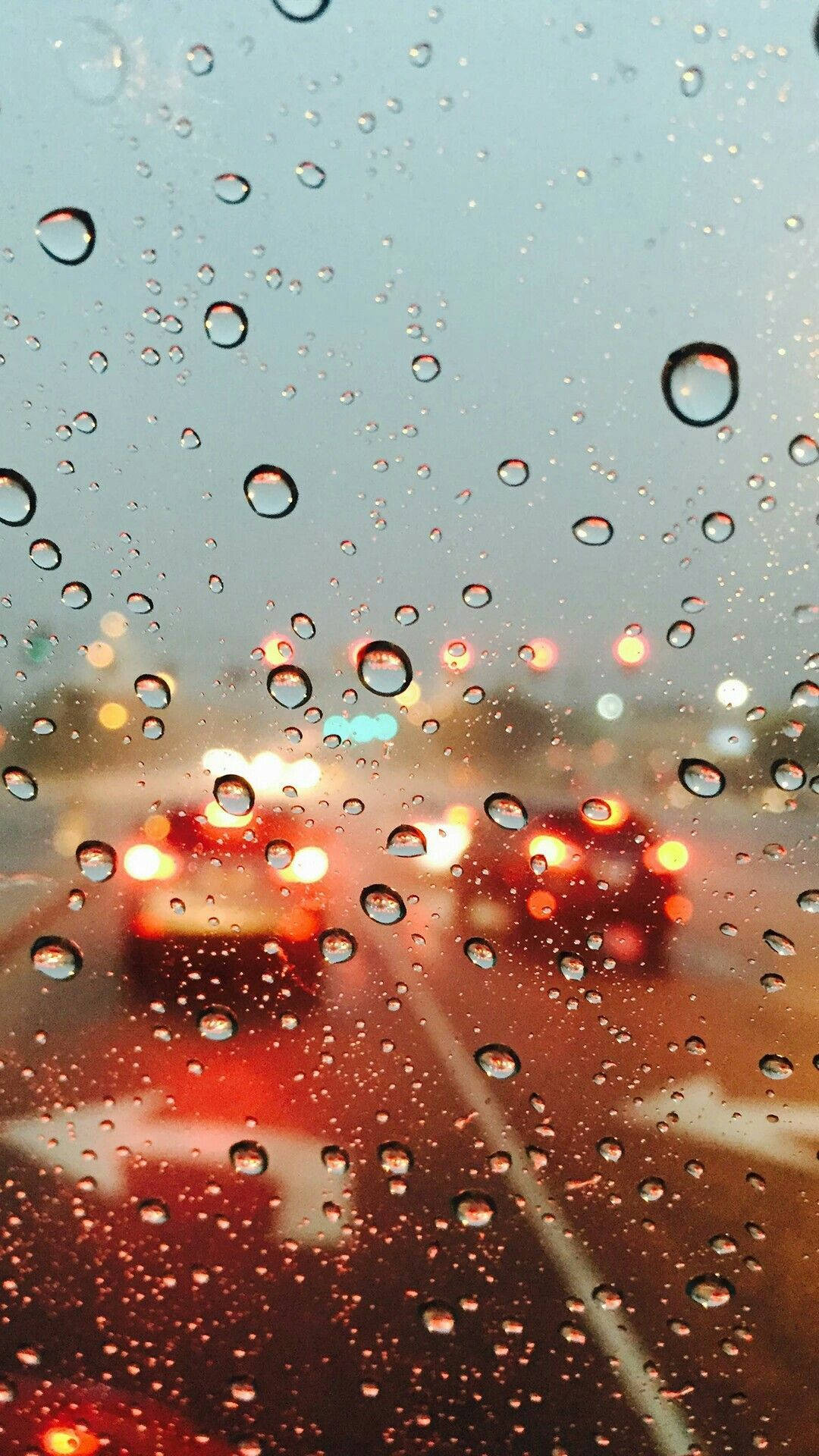 Raindrops On Car Glass Window Close Up Background