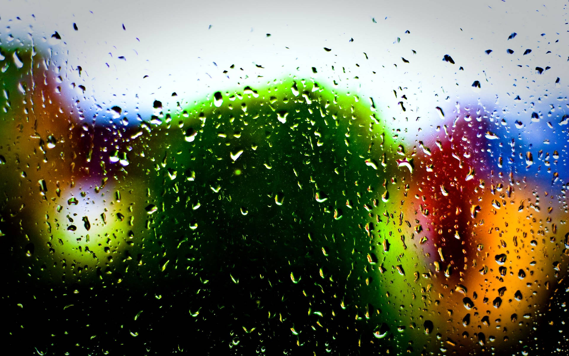 Raindrops On Glass Surface Multi Colored Bokeh
