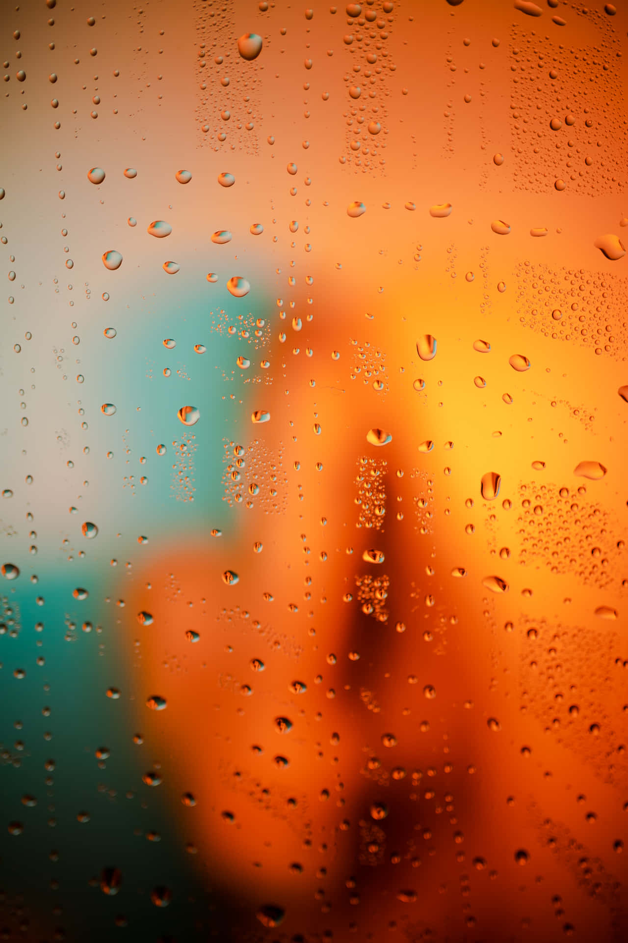 Raindrops On Orange And Teal Window Background