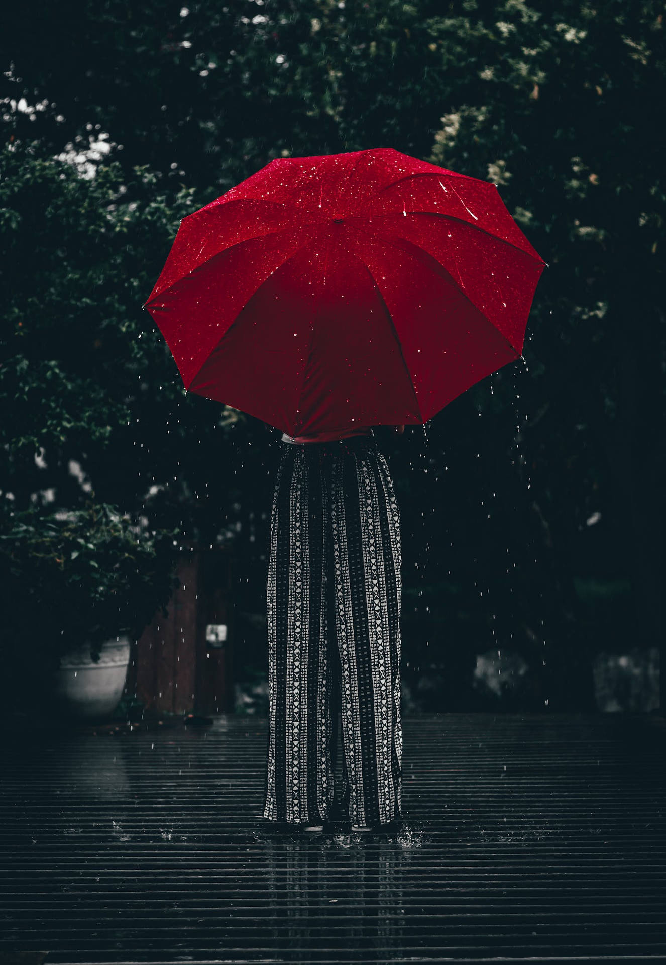 Raining Down On A Red Umbrella