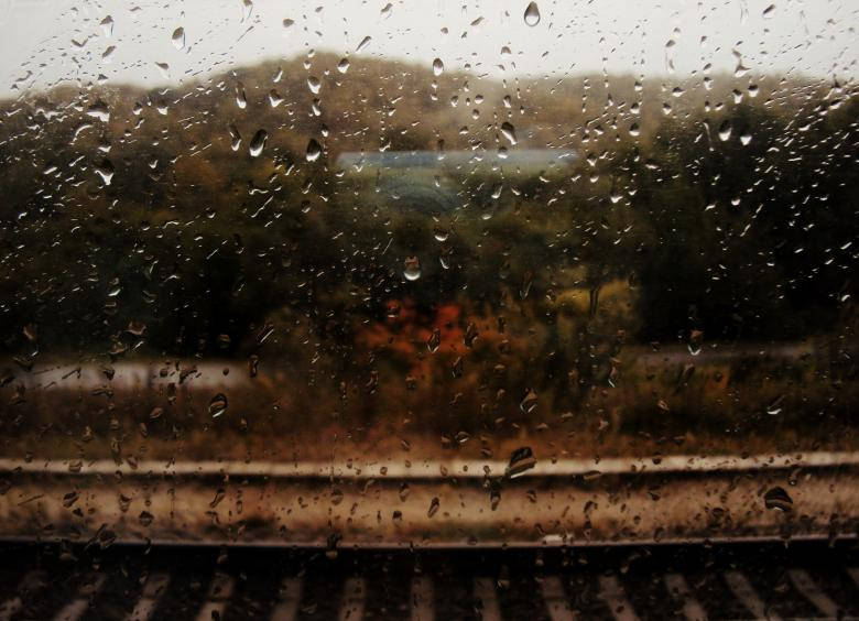 Raining On Train Tracks Background