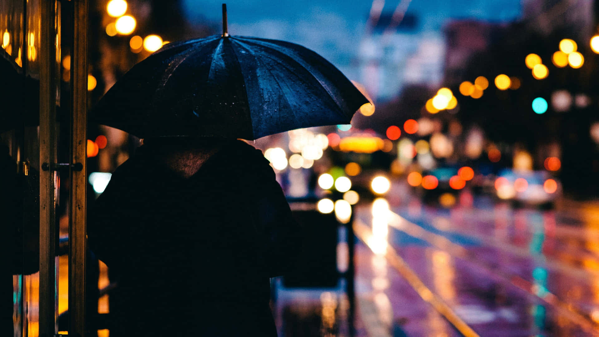Rainy Night City Lights Umbrella Background