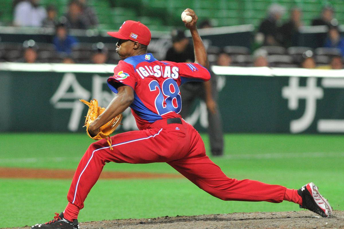 Raisel Iglesias Blue Red Background