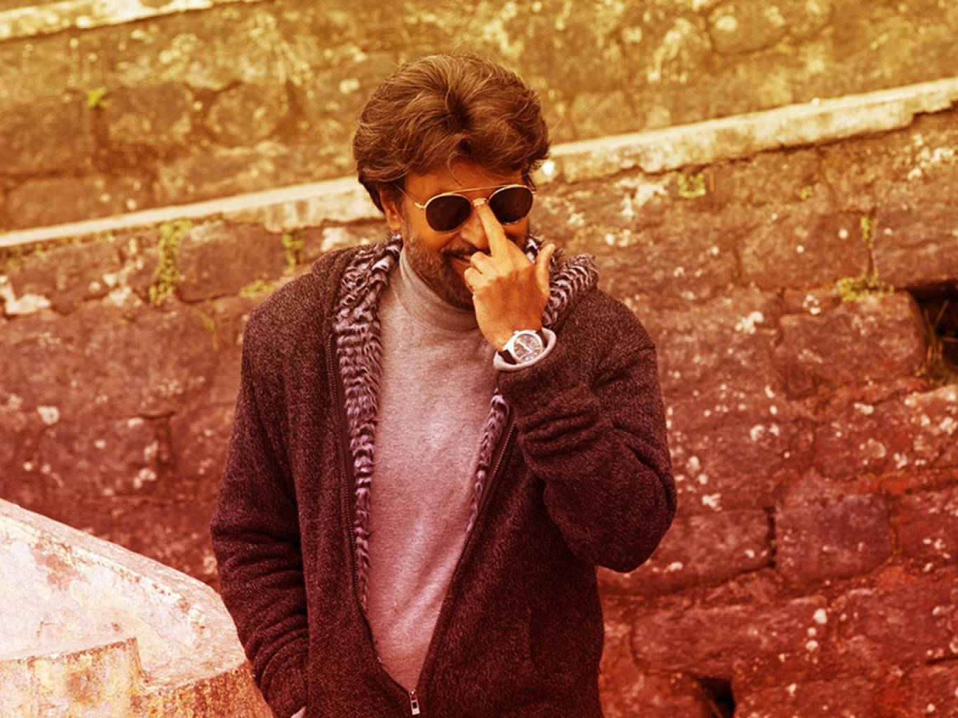 Rajinikanth's Stylized Finger Pose Background