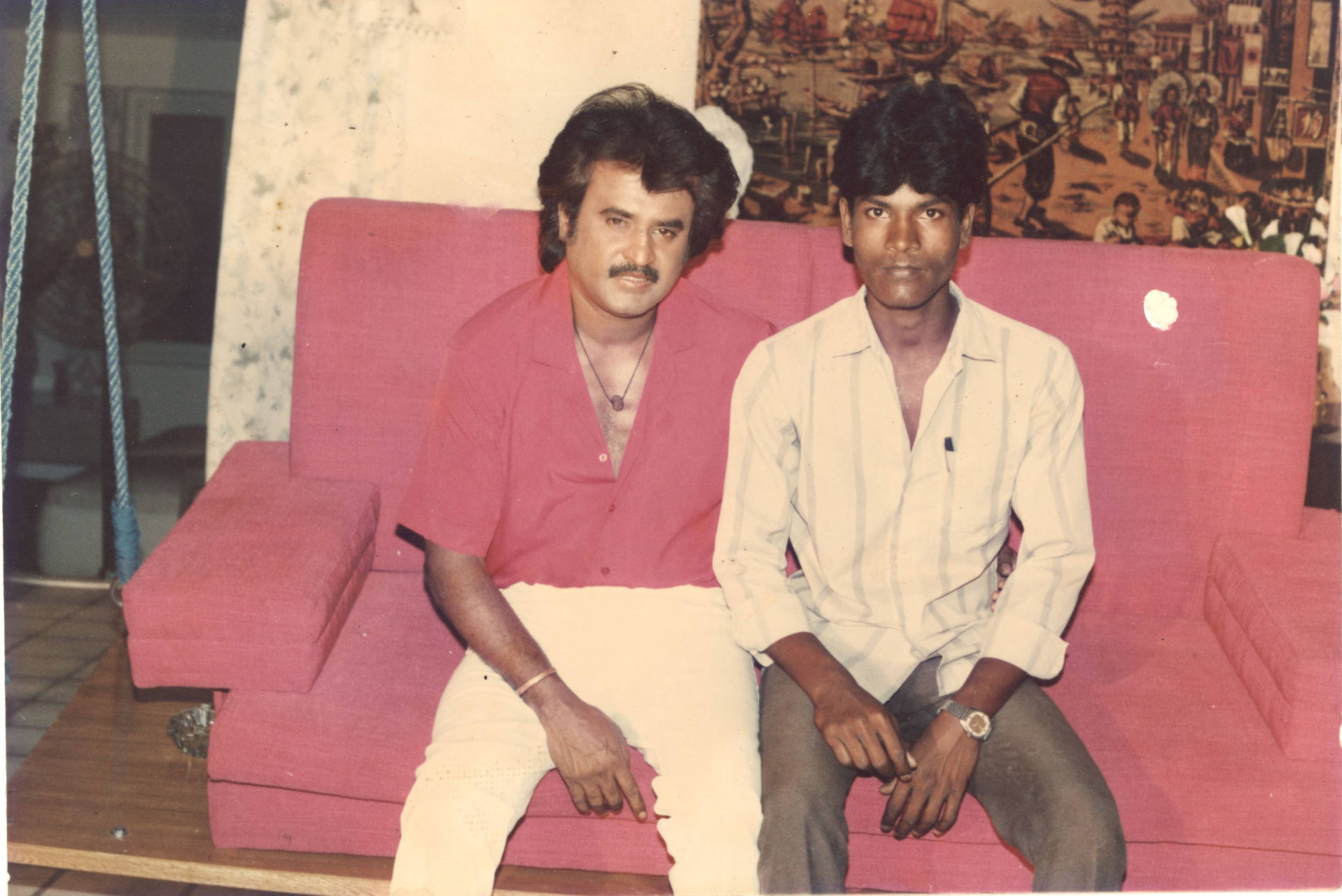 Rajinikanth With Friend On Sofa Background