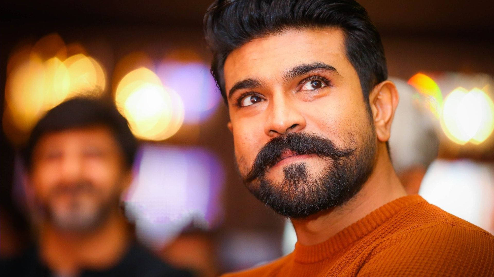 Ram Charan Looking Sophisticated In A Knitted Sweater Background
