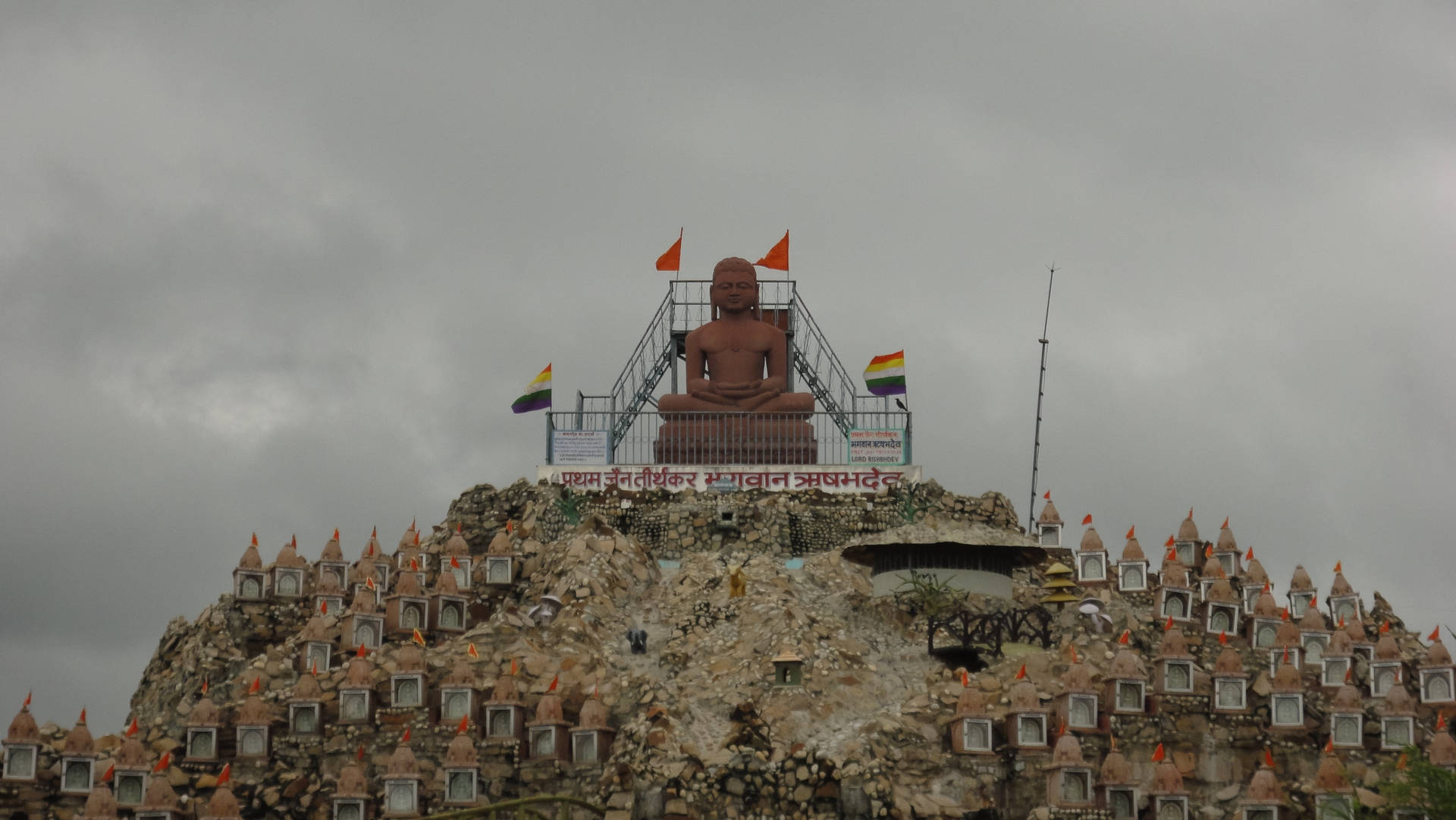 Ram Ji Rock Statue In Mountain Background