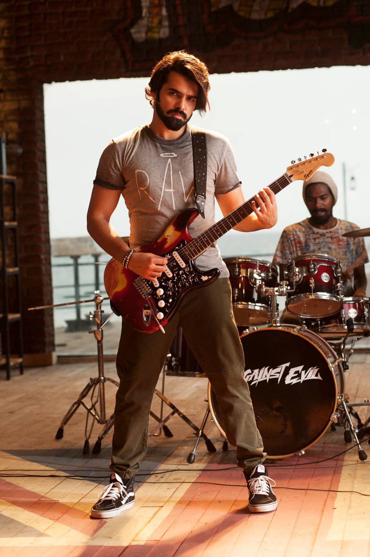 Ram Pothineni With Electric Guitar Background