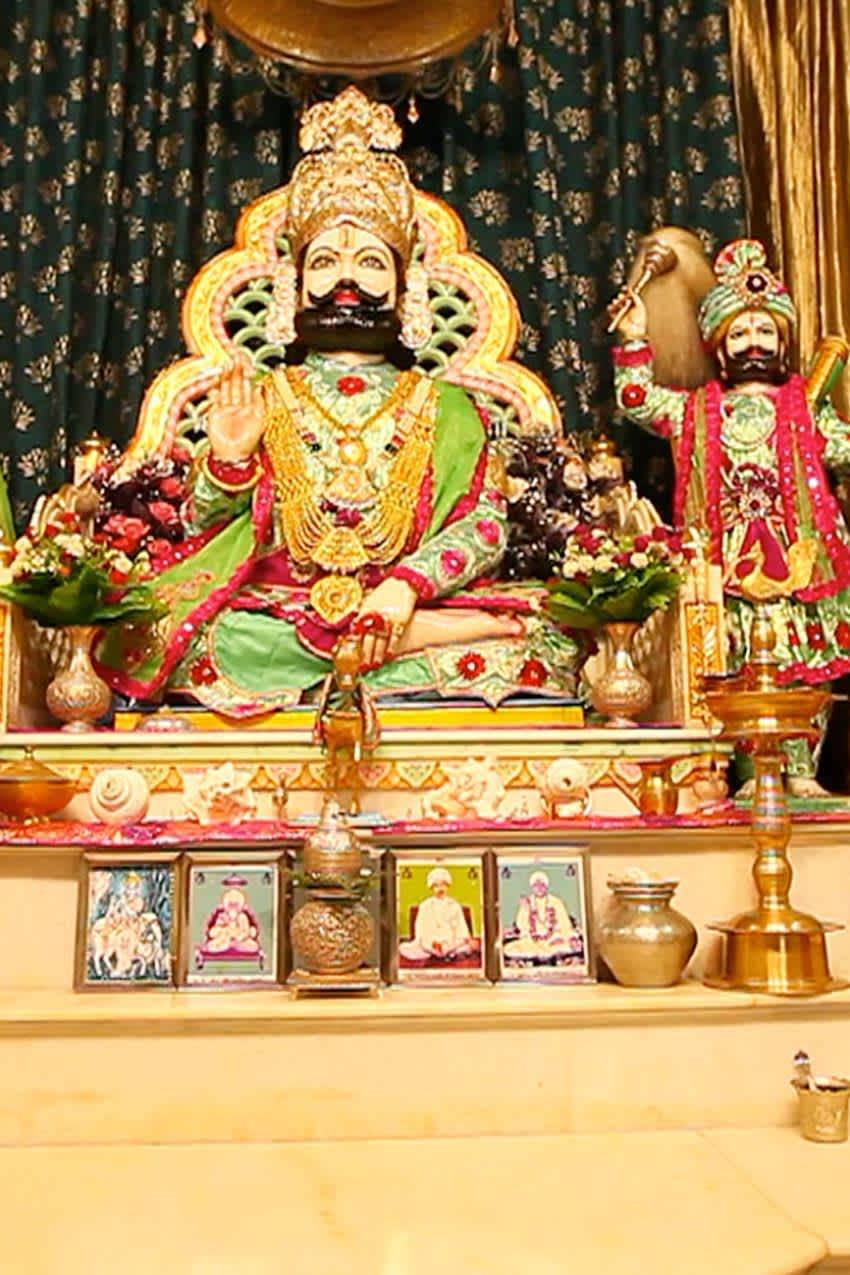 Ramapir Sits On His Altar Background