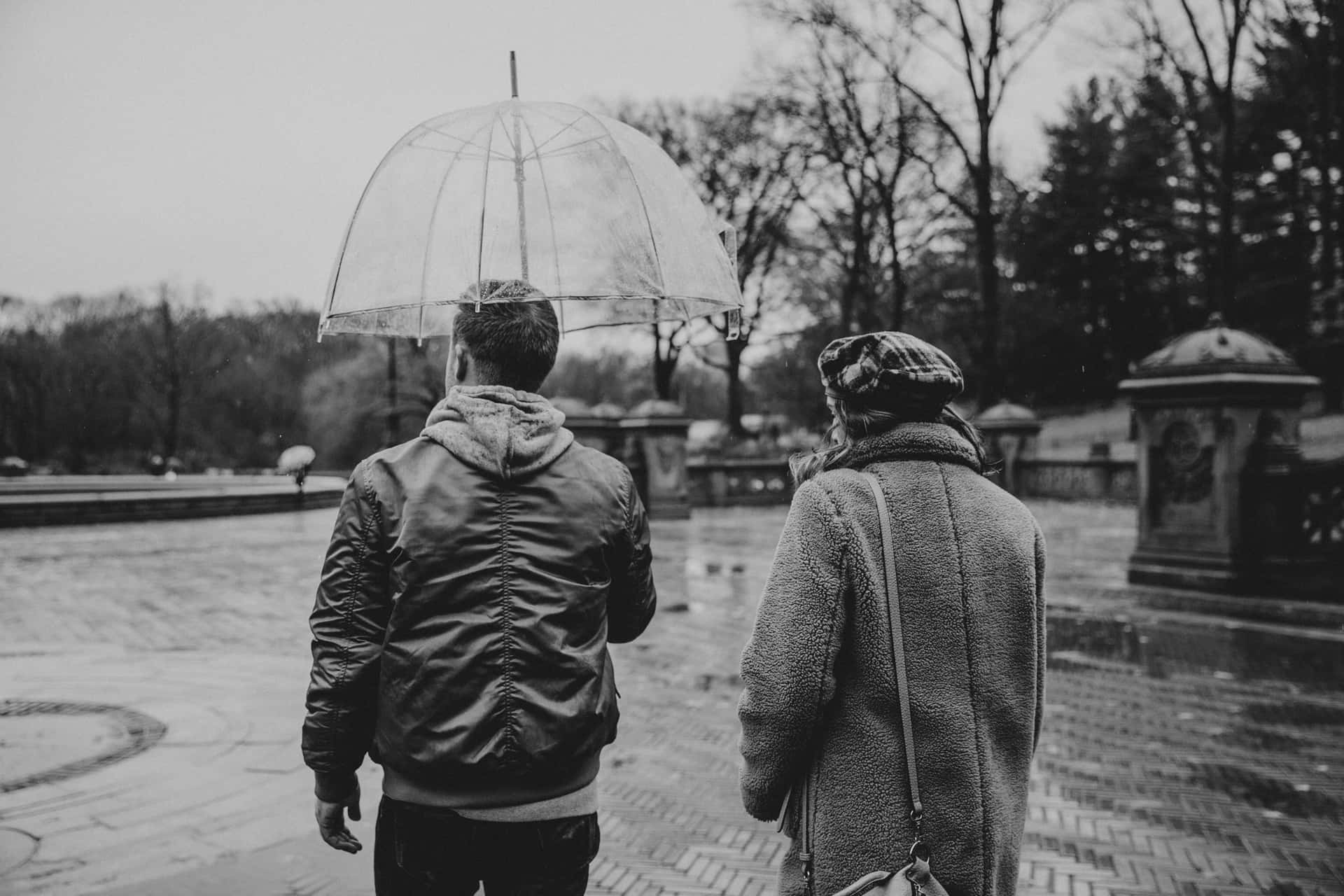 Random People Walking On A Rainy Day