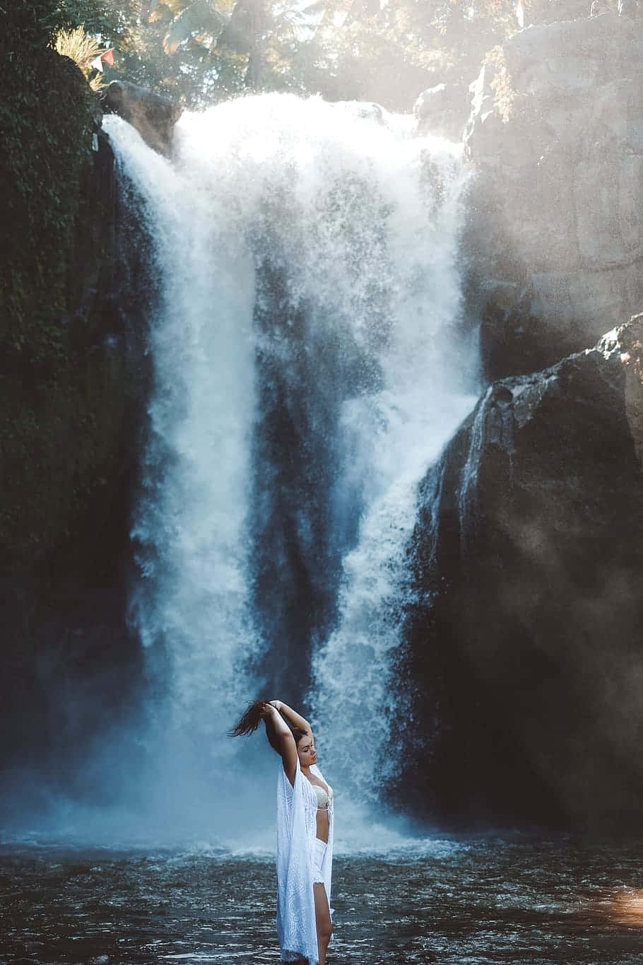 Random Person Bathing In Waterfall Background