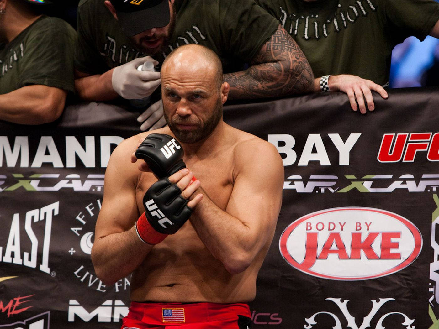 Randy Couture Adjusting Gloves Background