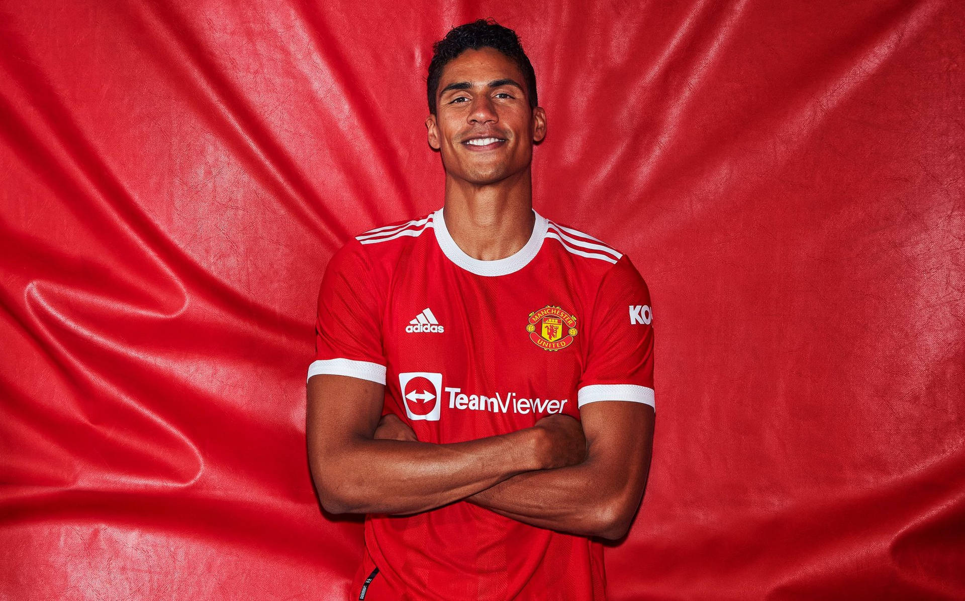 Raphael Varane Red Silk Background