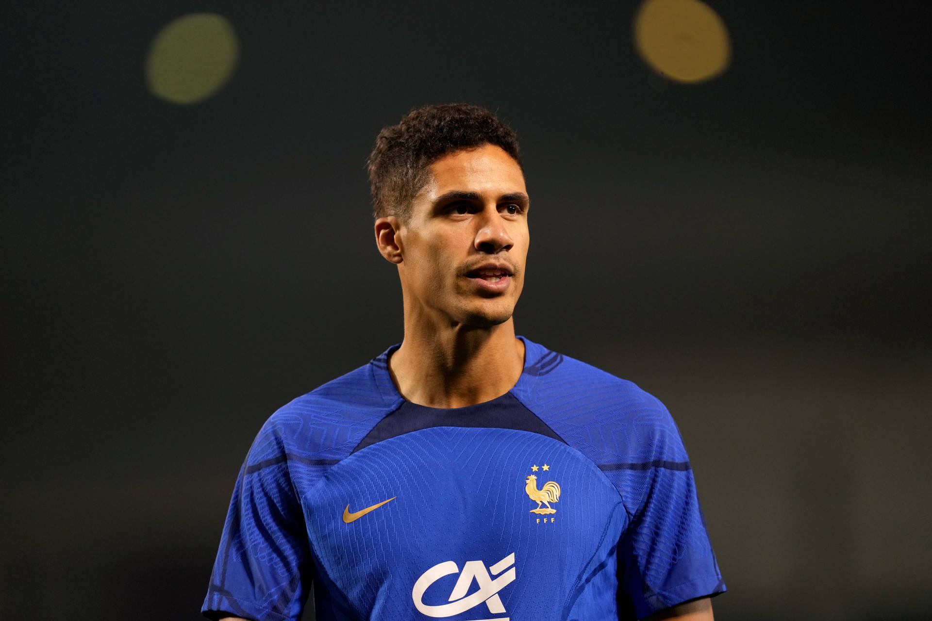 Raphael Varane Royal Blue Gold Background