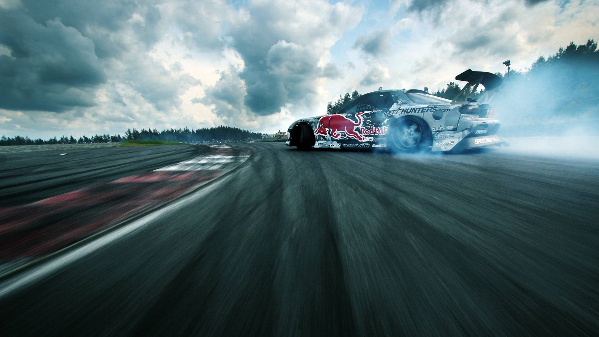 Rapid Velocity - Thrilling Low-angle Snapshot Of A Drifting Racing Car Background