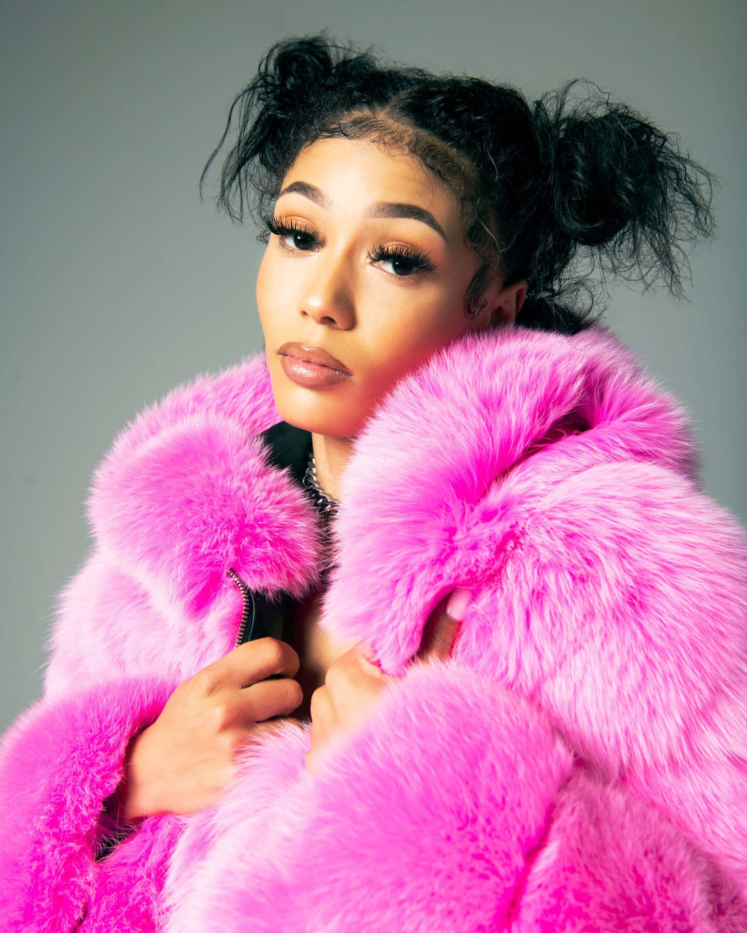 Rapper Coi Leray Looking Confident On Stage Background