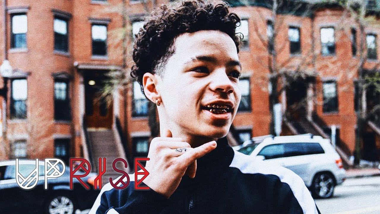 Rapper Lil Mosey Strikes A Pose Background