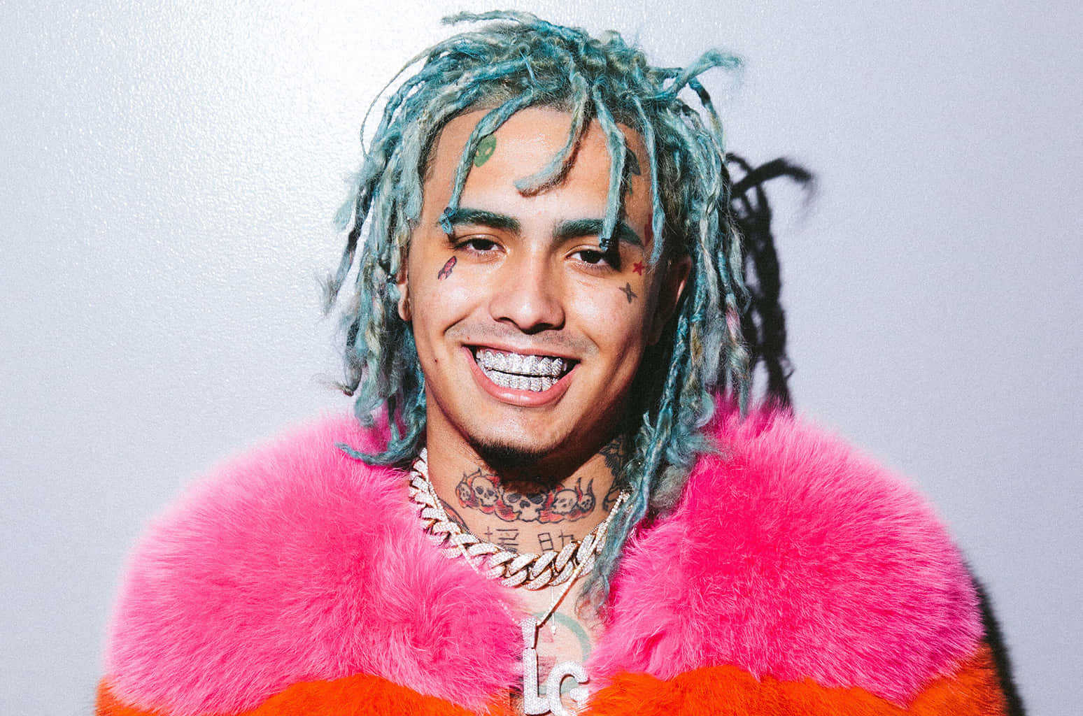 Rapper Lil Pump Illuminated Under Red Lights Background