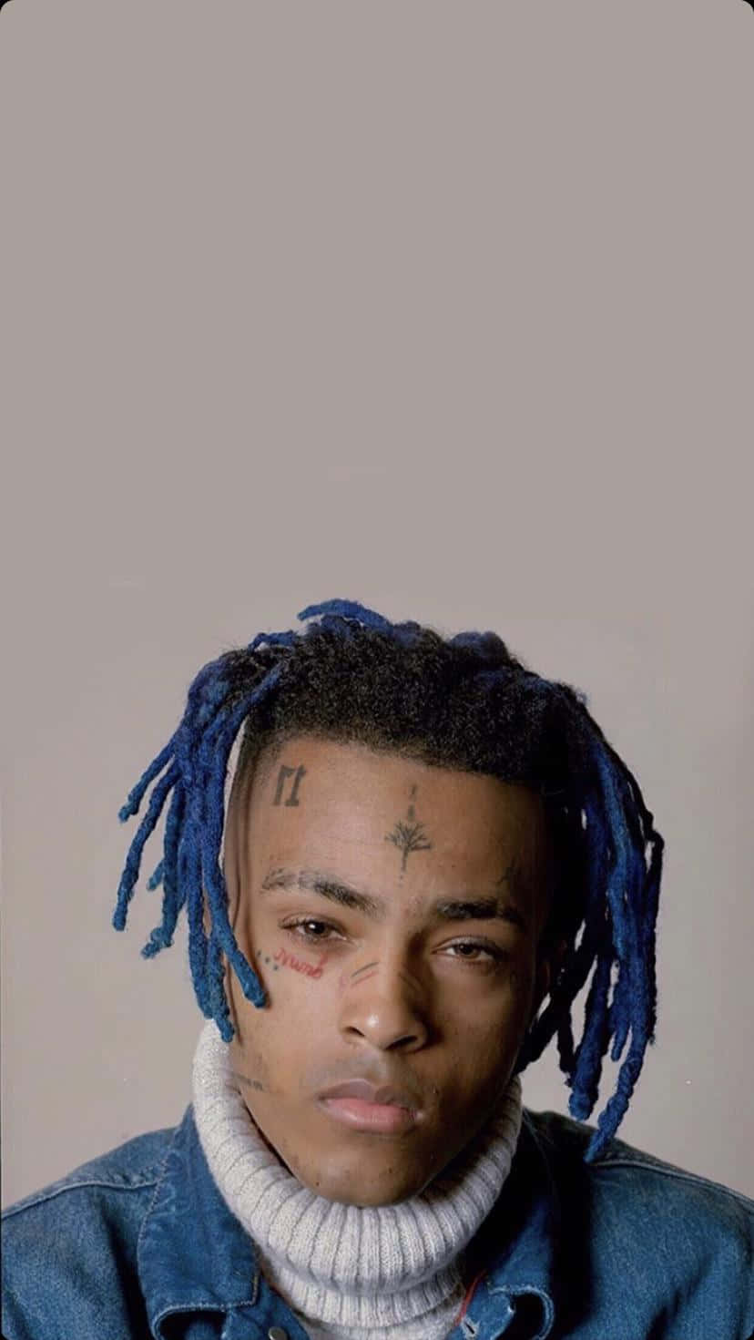 Rapper Xxxtentacion With Blue Hair. Background