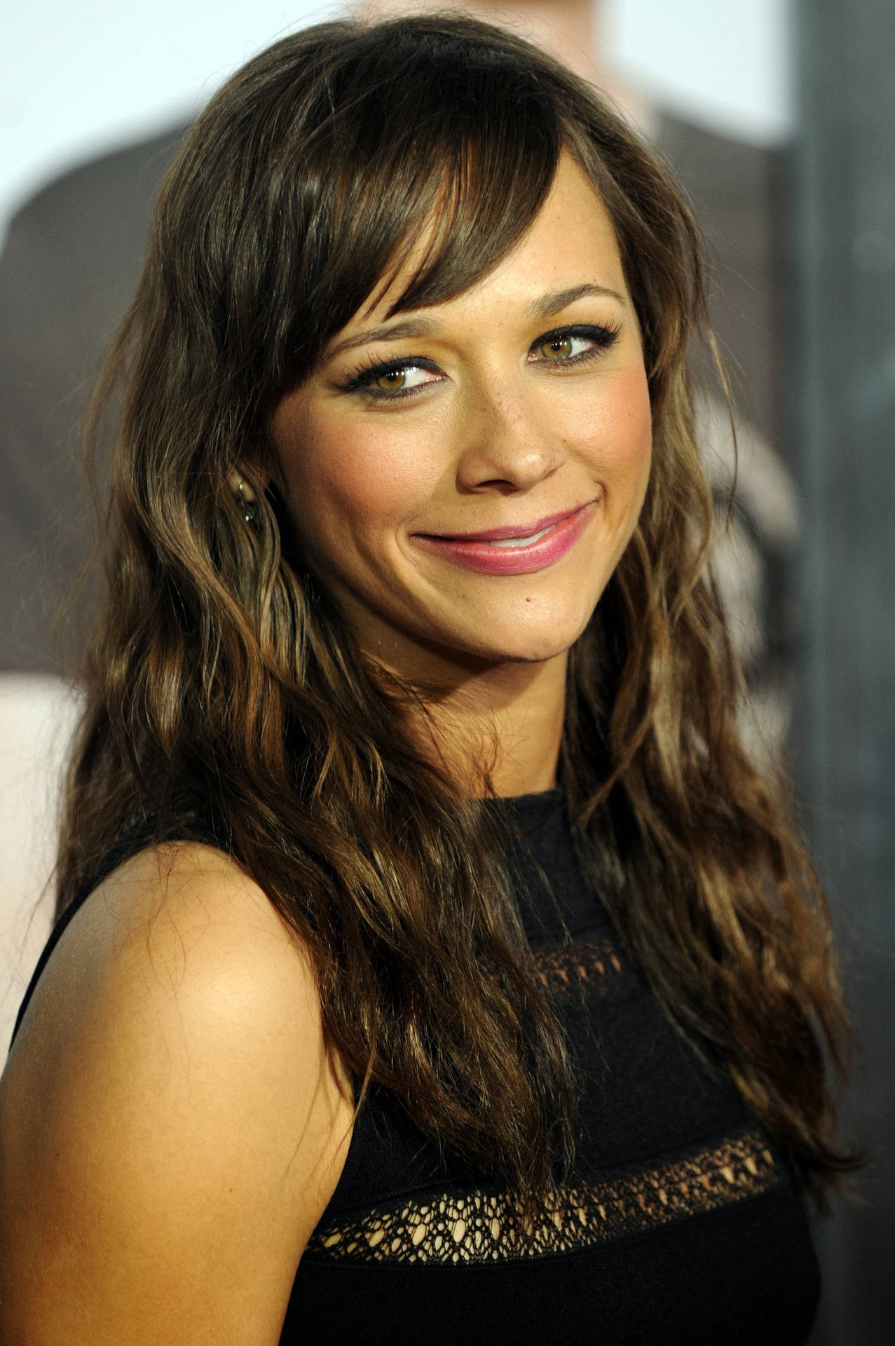 Rashida Jones Side View Smile Red Carpet Background