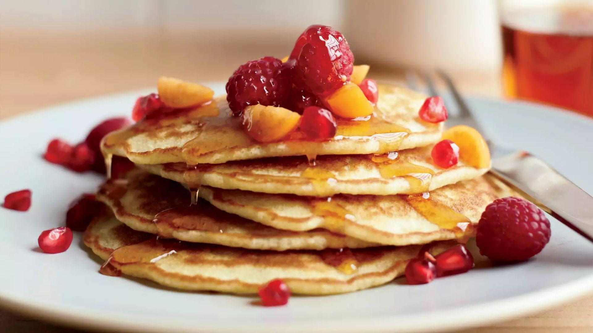 Raspberries On Pancakes Background