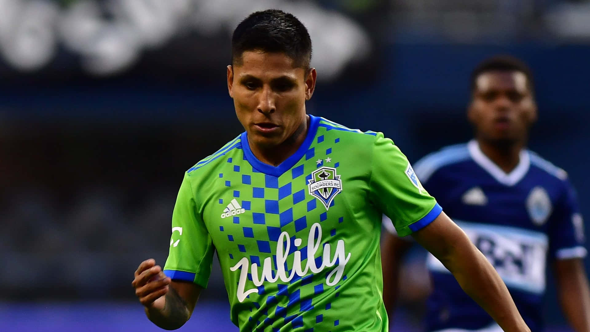 Raul Ruidiaz In Action On The Field Background