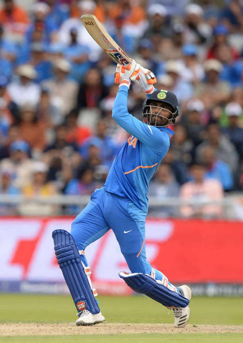 Ravindra Jadeja Raising A Bat Background