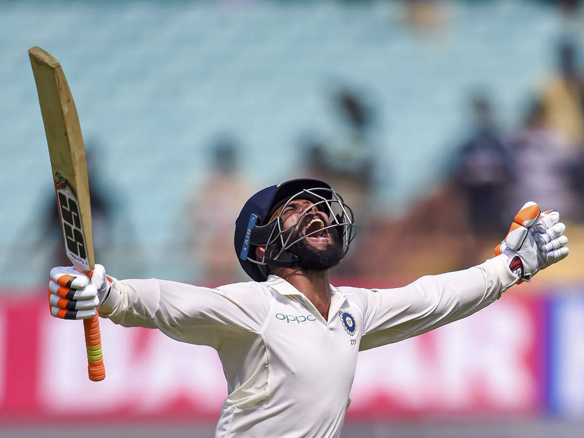 Ravindra Jadeja With Stretched Arms Background