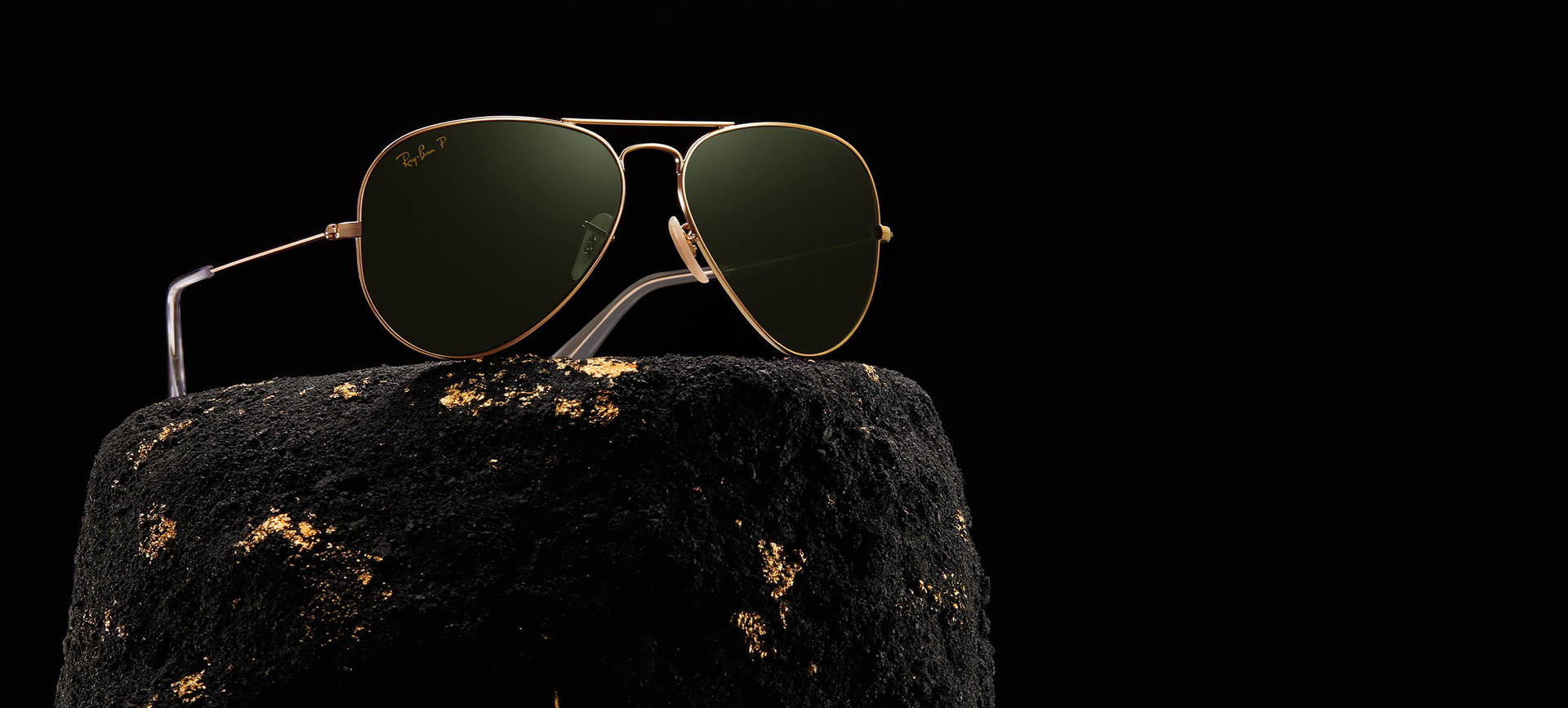 Ray-ban On A Rock Background