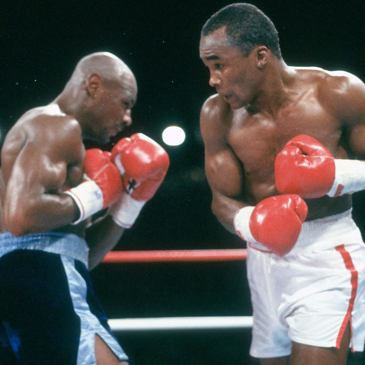 Ray Leonard Boxing With A Black Backdrop Background