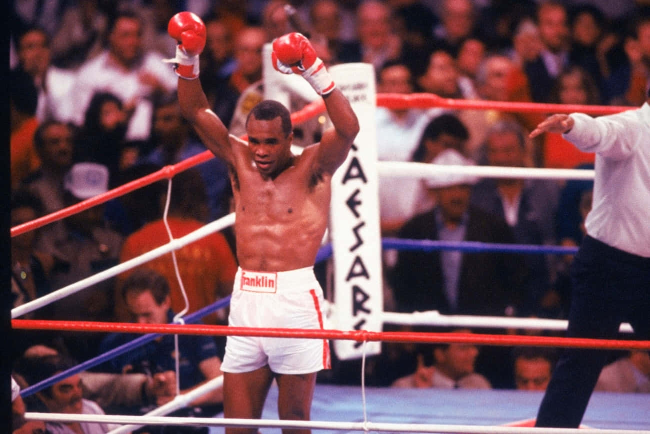 Ray Leonard Cheering And Raising His Fists Background