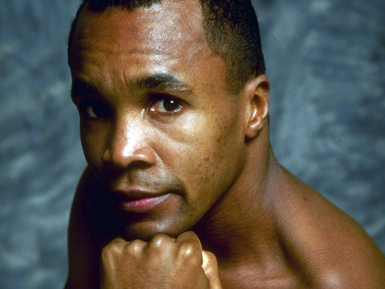 Ray Leonard Posing In Front Of Blue Backdrop Background