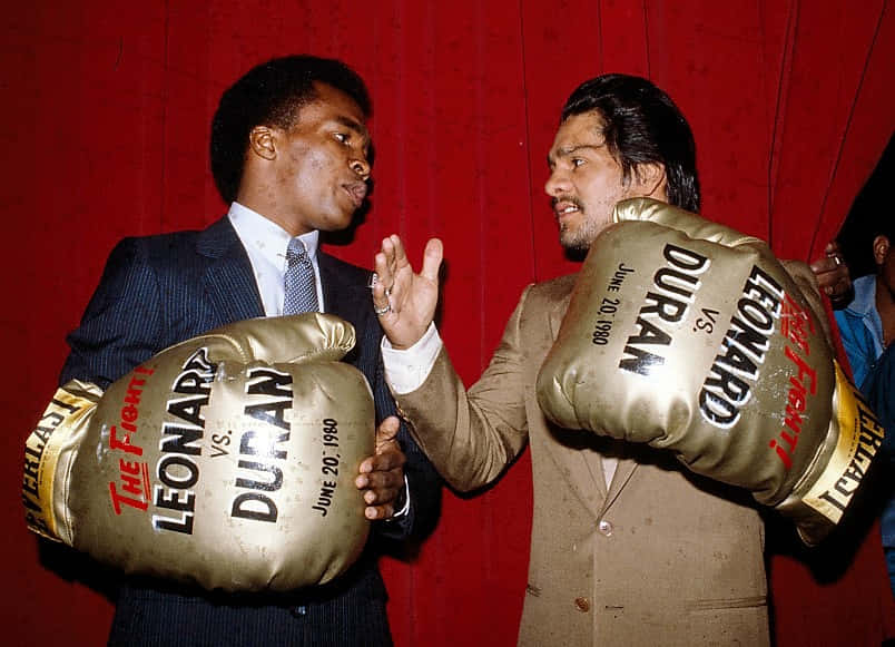 Ray Leonard With Comically Large Boxing Glove Background