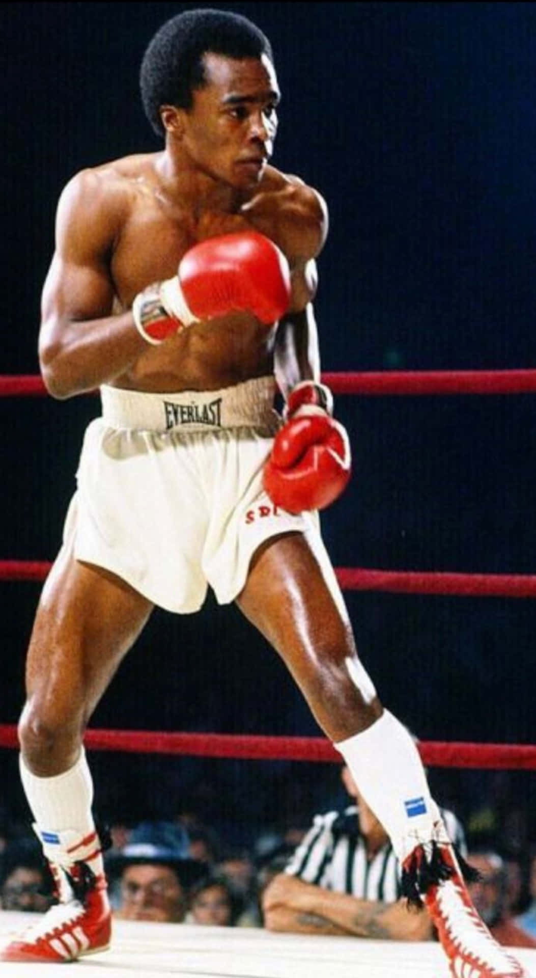 Ray Leonard With Red Gloves And Black Backdrop Background