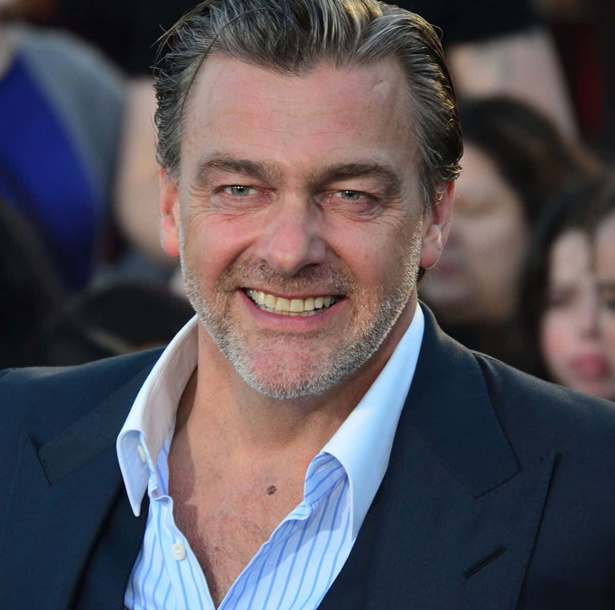 Ray Stevenson Posing In Black Jacket Background