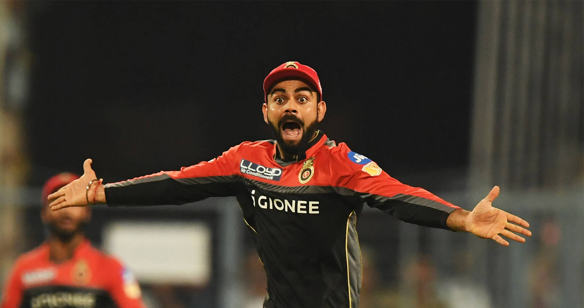Rcb Team Kohli Arms Outstretched Background