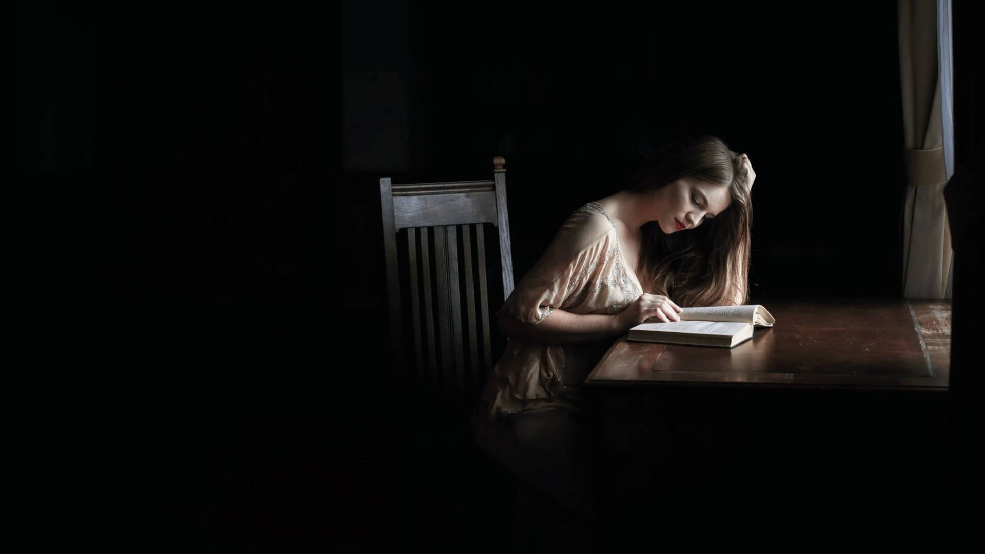 Reading Woman In Dark Room