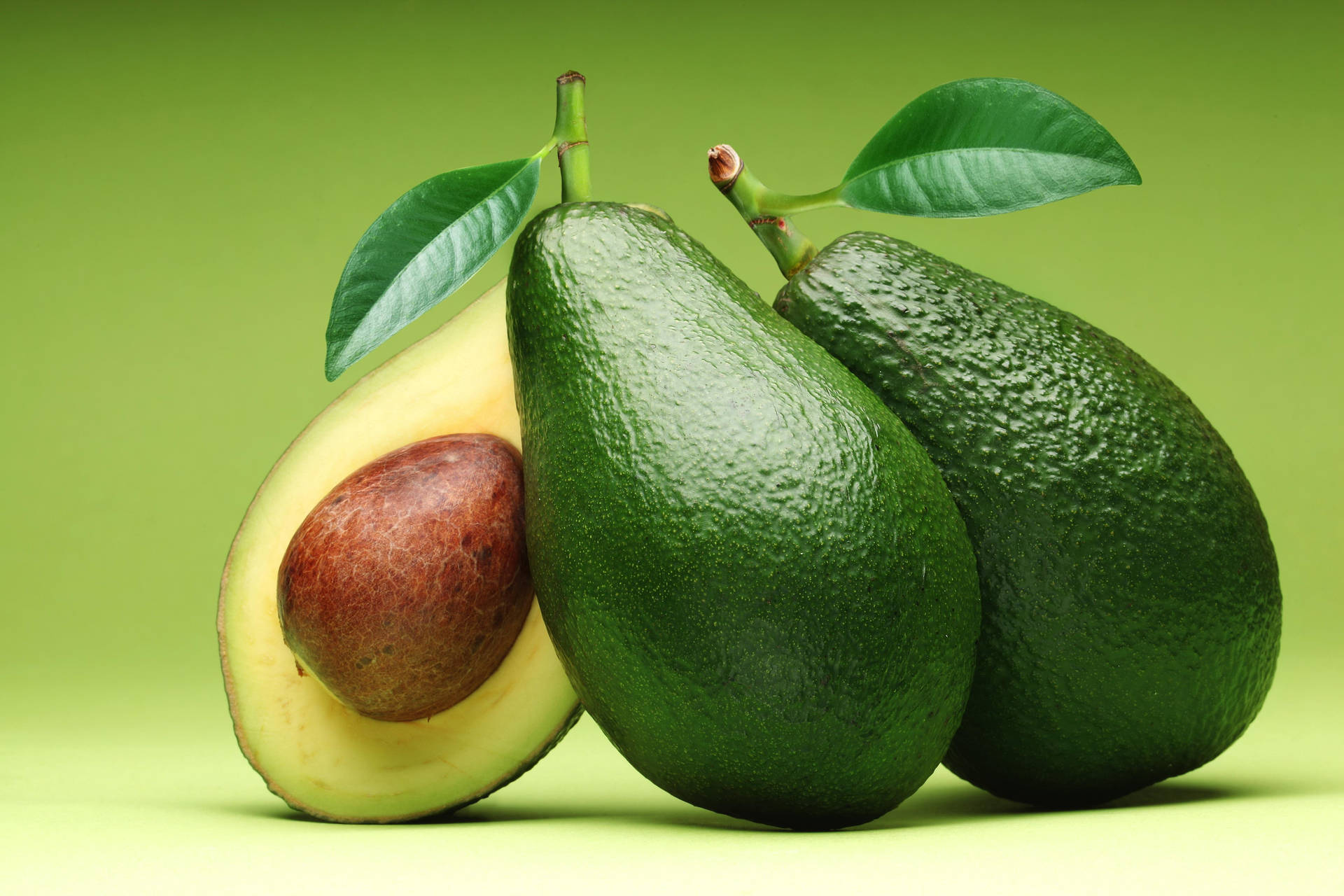 Real Avocado Fruit With A Leaf Portrait Image