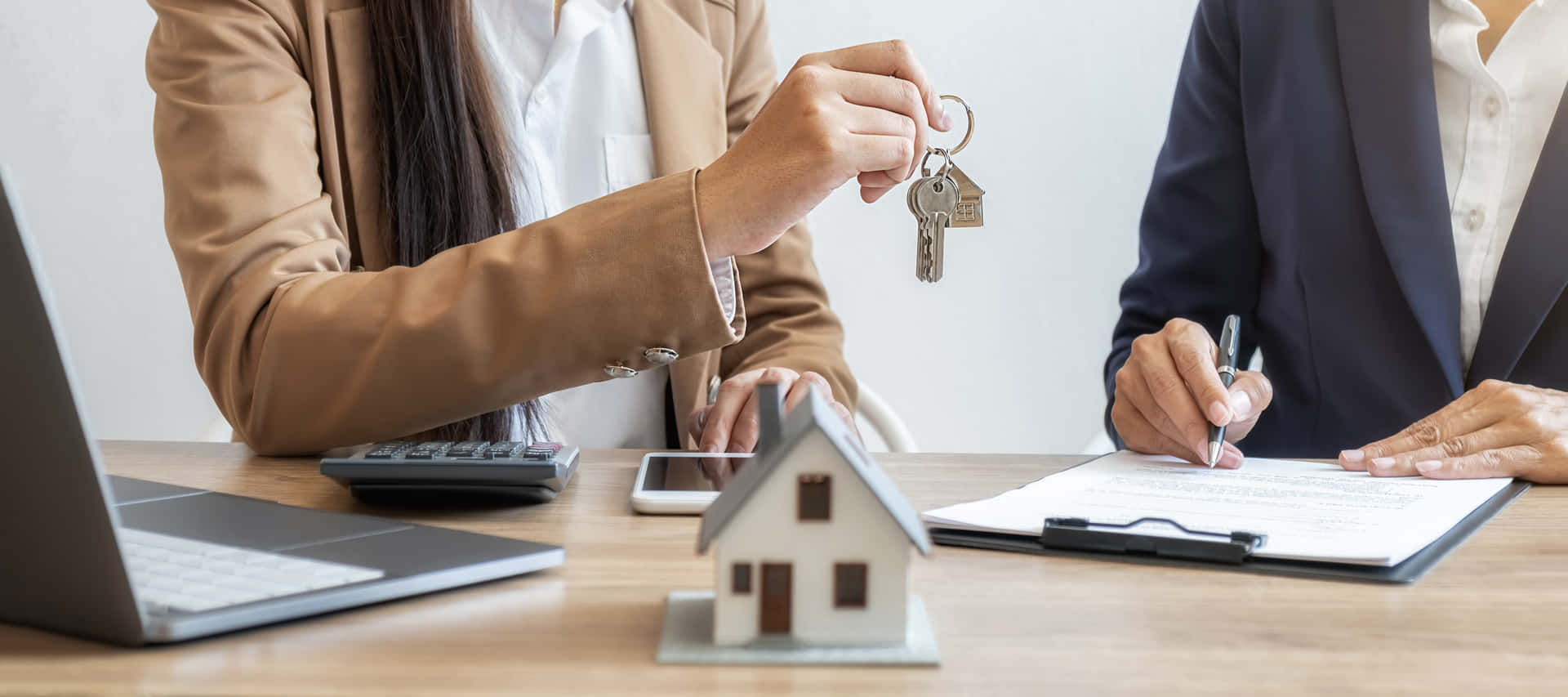 Real Estate Agent Handing Over House Keys Background