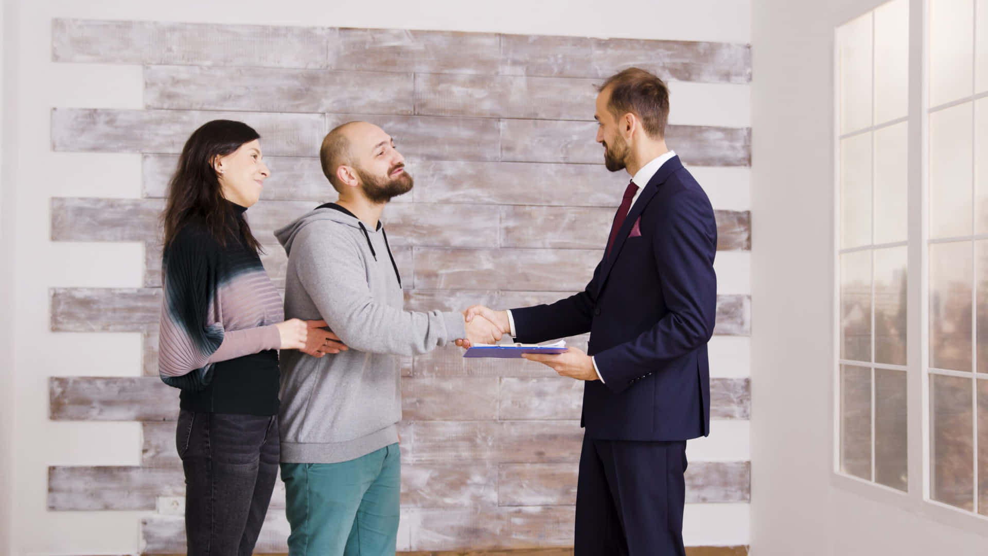 Real Estate Agent Handshake With Clients Background