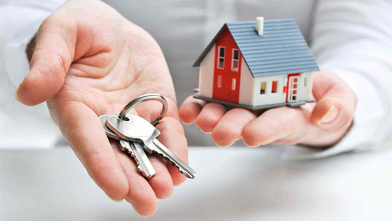 Real Estate Agent Holding House Keys Background