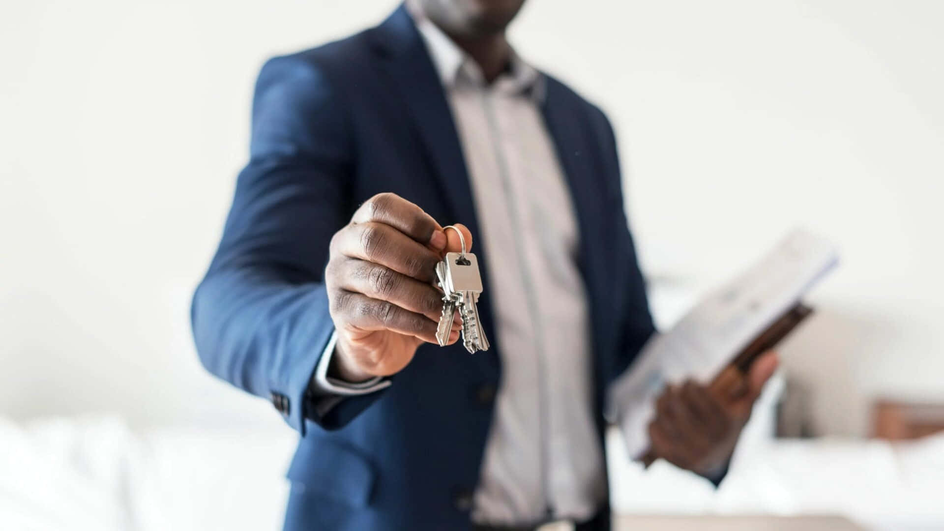 Real Estate Agent Offering House Keys Background