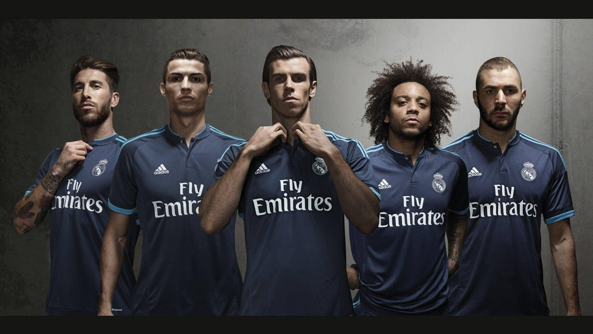 Real Madrid Players In Blue Jersey Background
