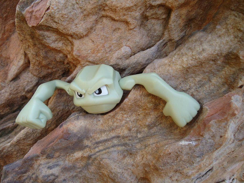 Realistic Geodude Pokemon On Rock Background