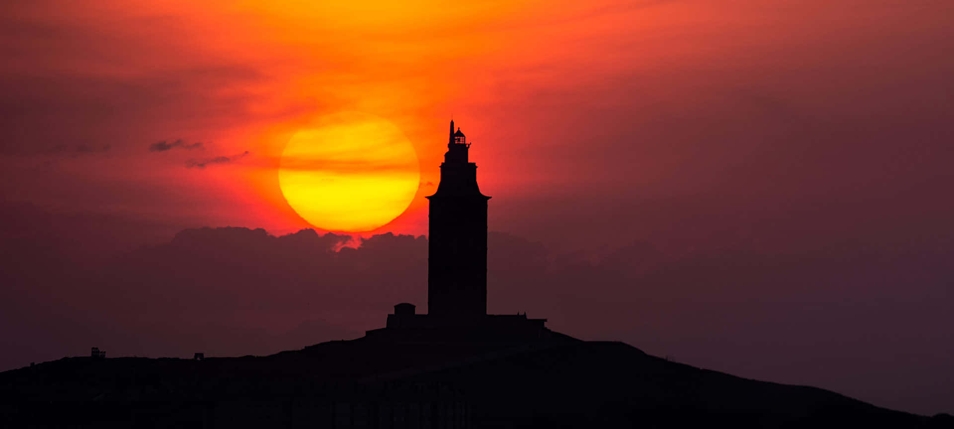 Red Aesthetic Sunset With Tower Of Hercules Background