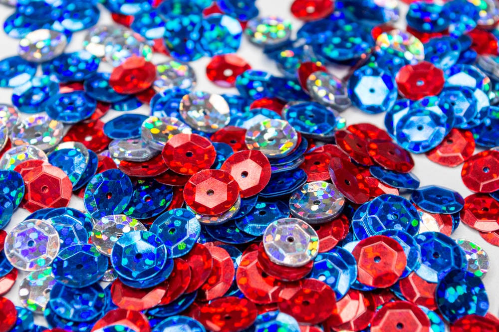 Red And Blue Sequins Background