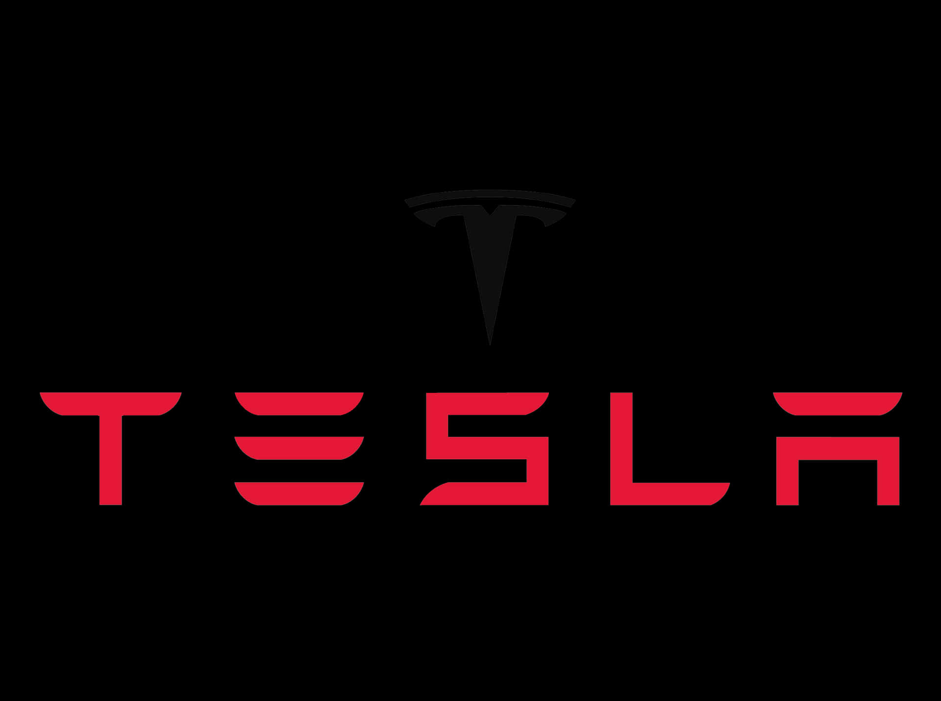 Red And Silver Tesla Logo Standing Out Against A Black Background Background