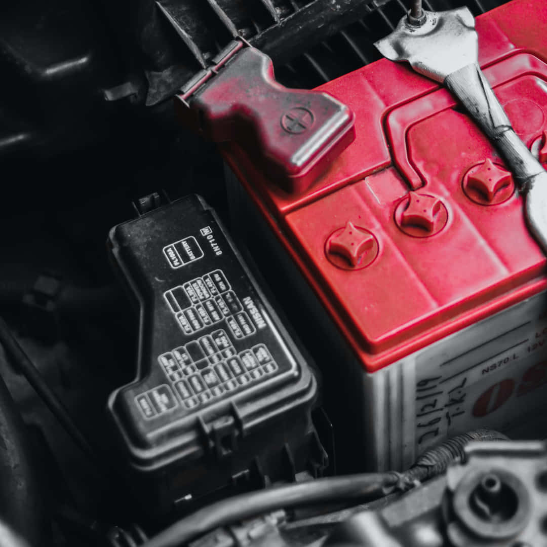 Red And White Motorcycle Battery Close Up Shot Background