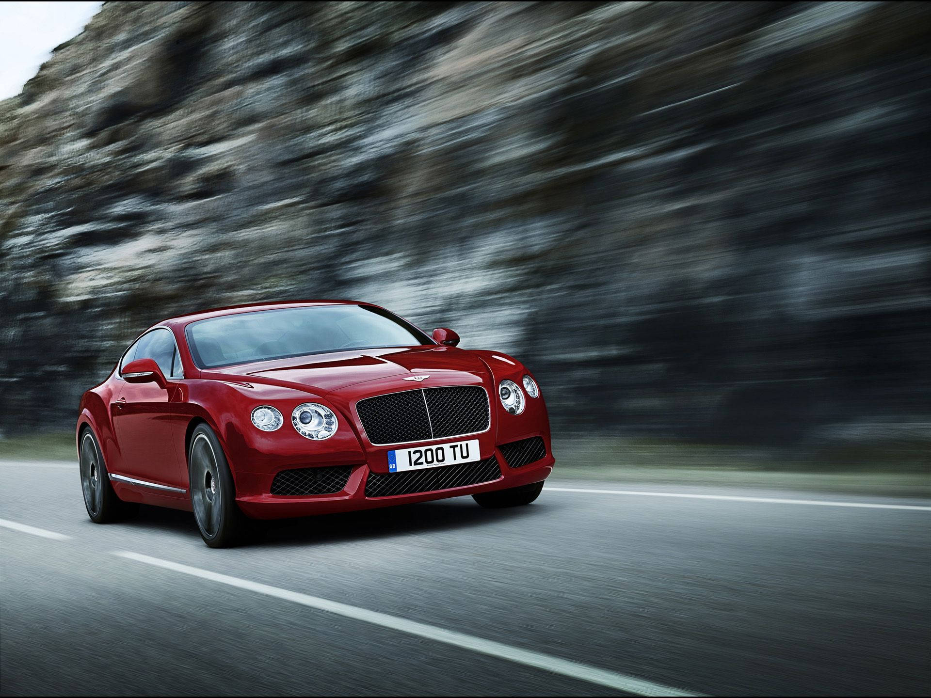 Red Bentley Speeding On The Road Background
